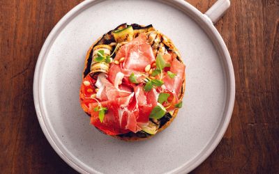 Toast topped with iberian ham and grilled seasonal vegetables